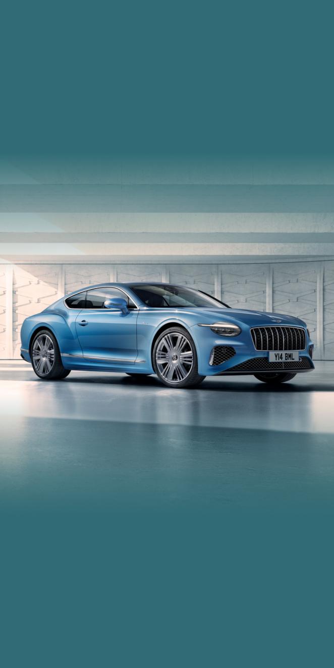 Front side angled view of Bentley Continental GT Azure V8 in Topaz Blue -by Mulliner, featuring 22 inch Ten Spoke Wheel-Black Painted and Bright Machined.