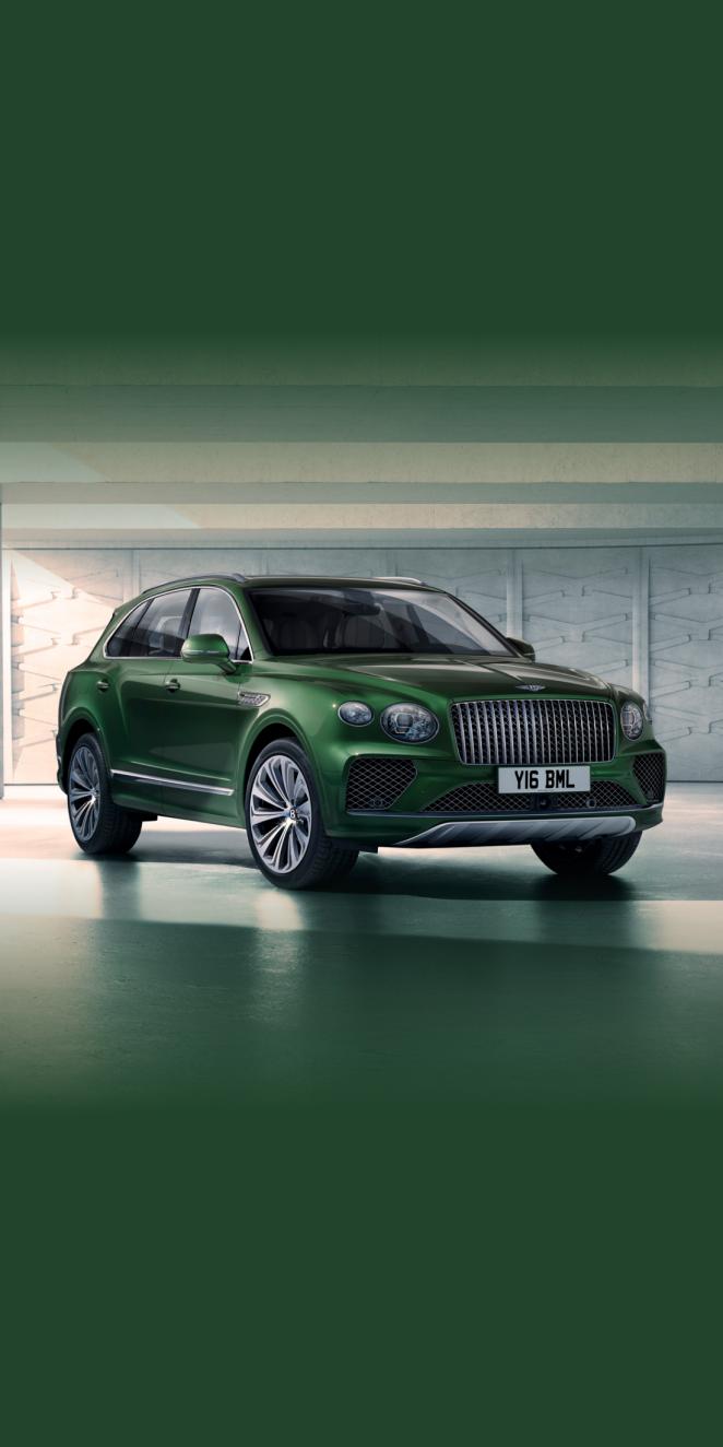 Front three quarter of the Bentayga Atelier Edition in an Emerald exterior colours with bright chrome accents