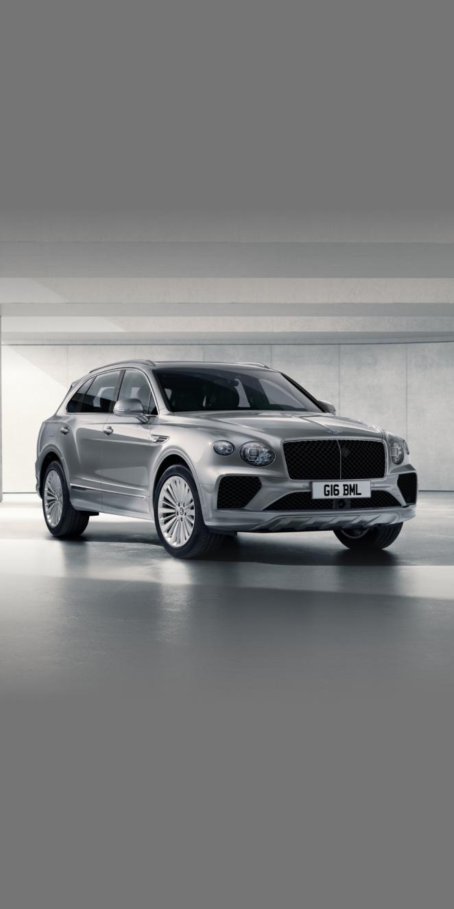 Bentley Bentayga in Moonbeam colour side angled view featuring 21 inch Five Twin-Spoke Wheel-Painted and chrome accent side skirt.