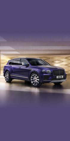 Bentley Bentayga EWB Mulliner  in Tanzanite Purple colour side angled view featuring 22 inch Mulliner Wheels and chrome accent side skirt.