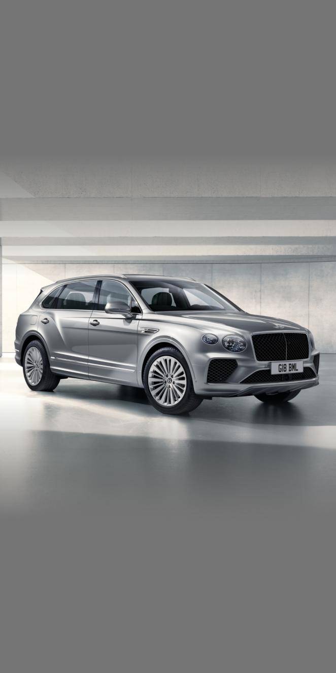 Bentayga EWB in Hallmark side angled view featuring 20 inch wheels and chrome accent side skirt