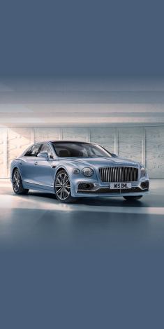 Front side angled view of Bentley Flying Spur A v8 in Silverlake colour, featuring 21 inch Ten Twin Spoke Wheel - Dark Grey Painted and Bright Machined.