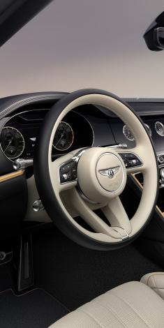 Interior view of Bentley Flying Spur Mulliner overlooking Heated, Duo-Tone, 3 Spoke, Hide Trimmed Steering Wheel.