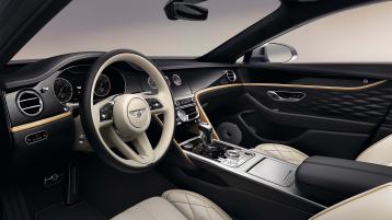 Interior view of Bentley Flying Spur Mulliner overlooking Heated, Duo-Tone, 3 Spoke, Hide Trimmed Steering Wheel.