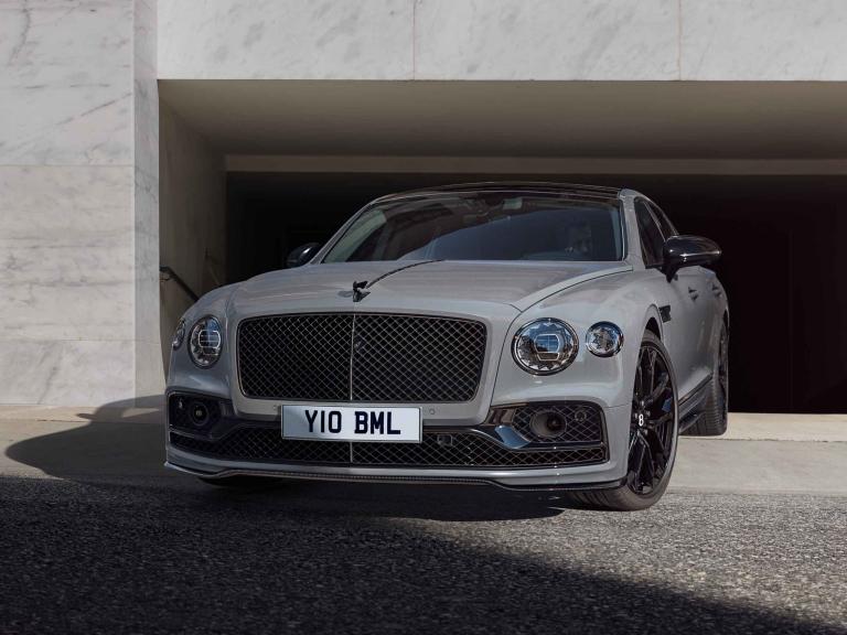 Front side angled view of Bentley Flying Spur S V8 in Cambrian Grey colour,  Flying 'B' mascot - black gloss and Jewel-like LED matrix headlamps