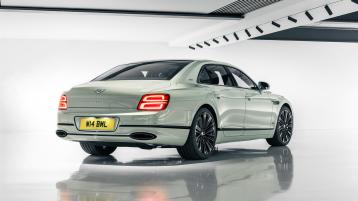 Rear side angled view of Bentley Flying Spur Speed Edition 12 in Opalite colour featuring Chrome ‘BENTLEY’ lettering to Boot and diamond knurled full LED tail lamps.