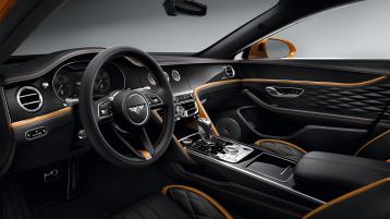Bentley Flying Spur Speed driver's view - featuring Single Tone, 3 spoke steering wheel in High Gloss Carbon Fibre veneer and Mandarin by Mulliner