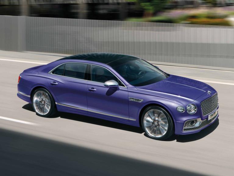 Top view of Bentley Flying Spur Mulliner W 12 in Tanzanite Purple colour driving along a road.