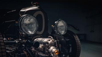Front view of Bentley Blowe featuring two halogen headlamps in chrome grilled covering.