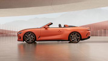 Bentley Batur Convertible by Mulliner in Satin Orange Flame, side view featuring 22" 5 spoke directional alloy wheel 