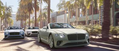 Three Bentley Continental GTCs driving along a downtown avenue with Bentley Continental GTC Speed driving