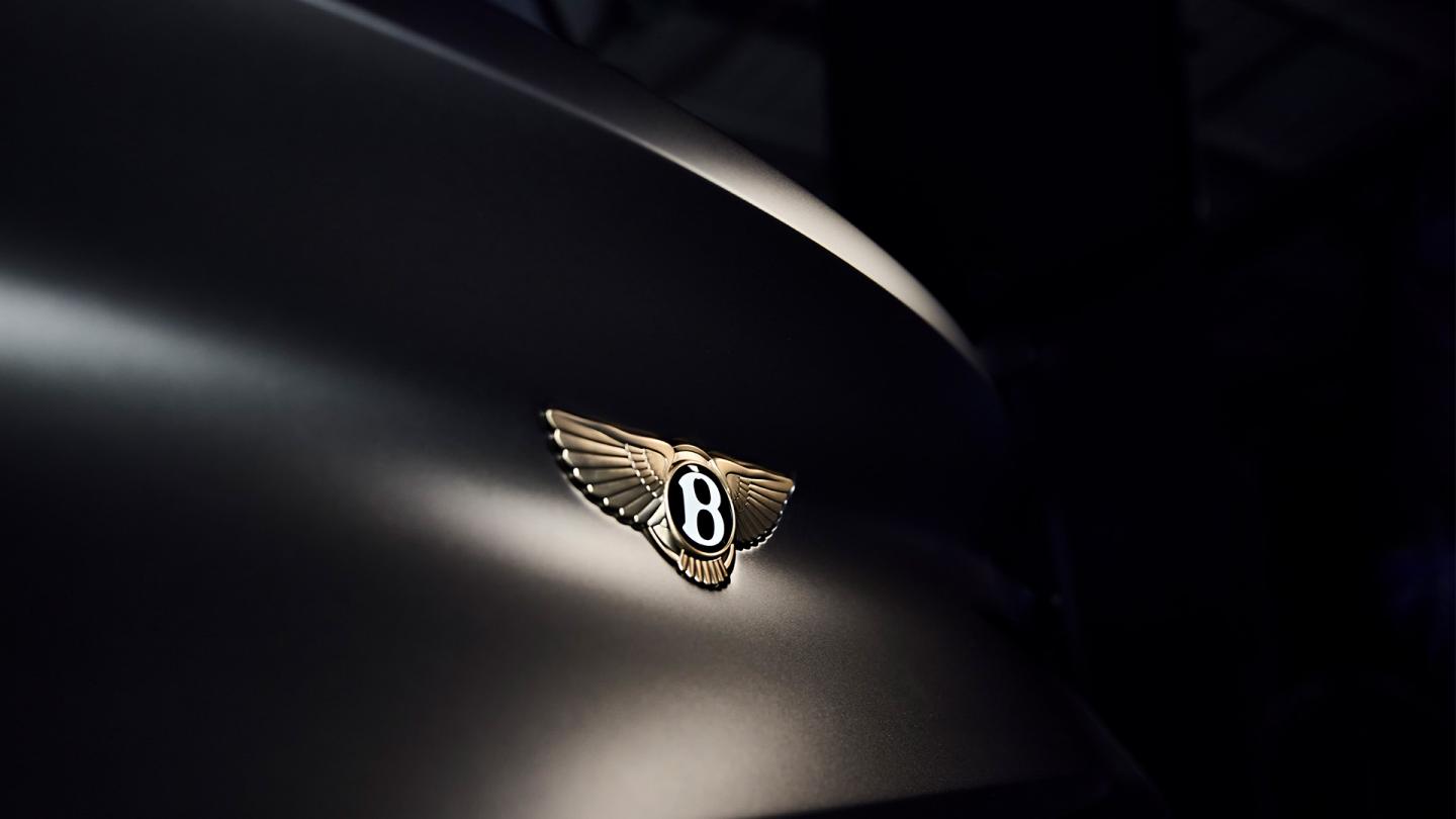 Close up of the gold Bentley wings available exclusively on the Virtuoso Collection by Mulliner