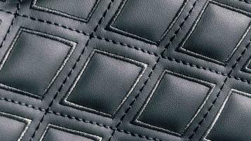 Detailed diamond patterned stitching set in Beluga Hide.