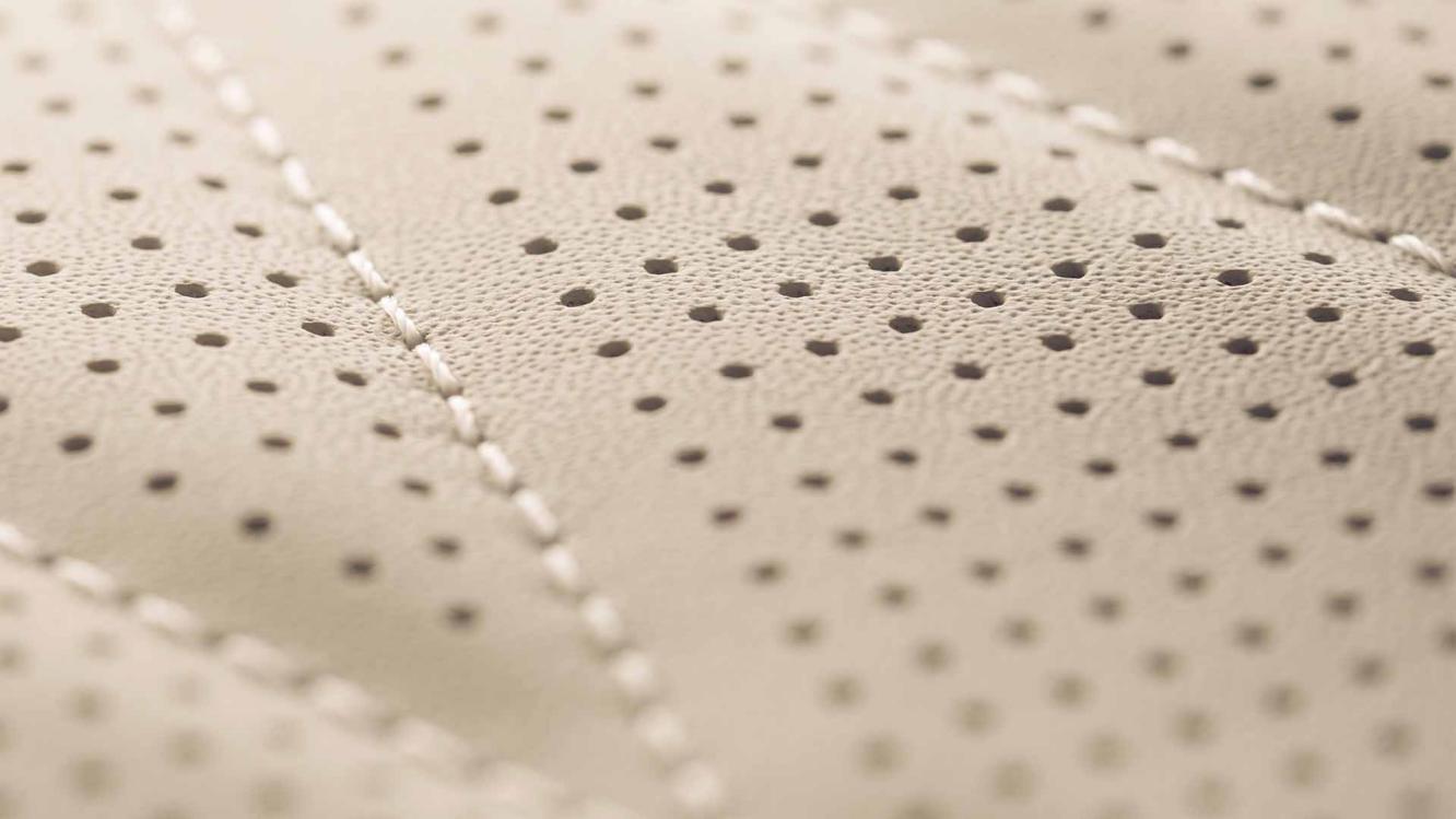 Close up of detailed contrast stitching set in Portland hide.