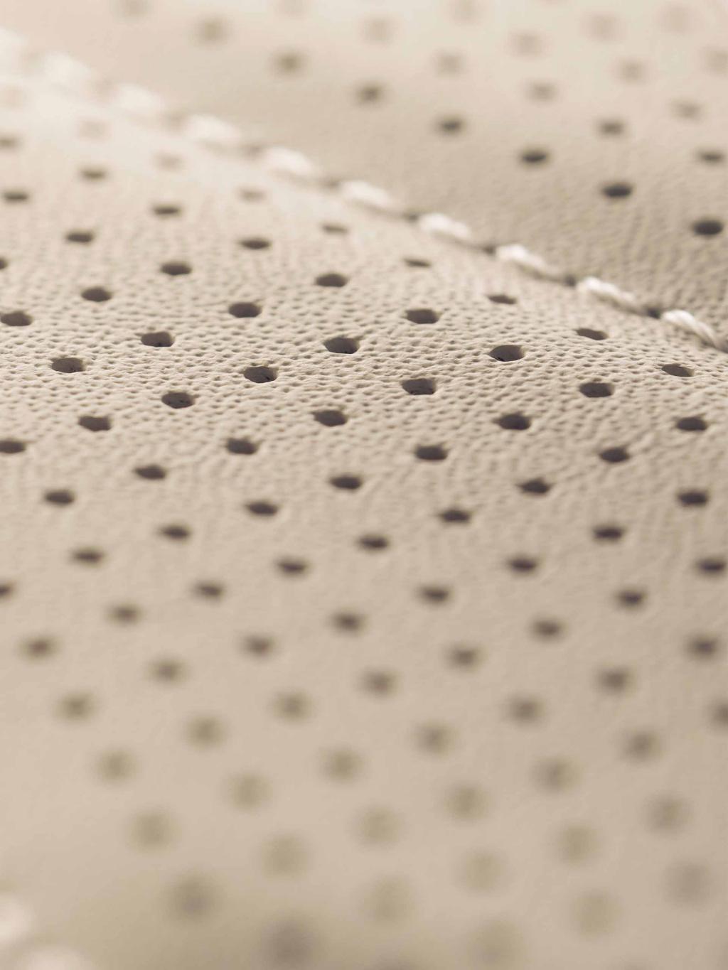 Close up view of Bentley Flying Spur Azure V8 diamond patterned seat in Linen/Magnolia hide.