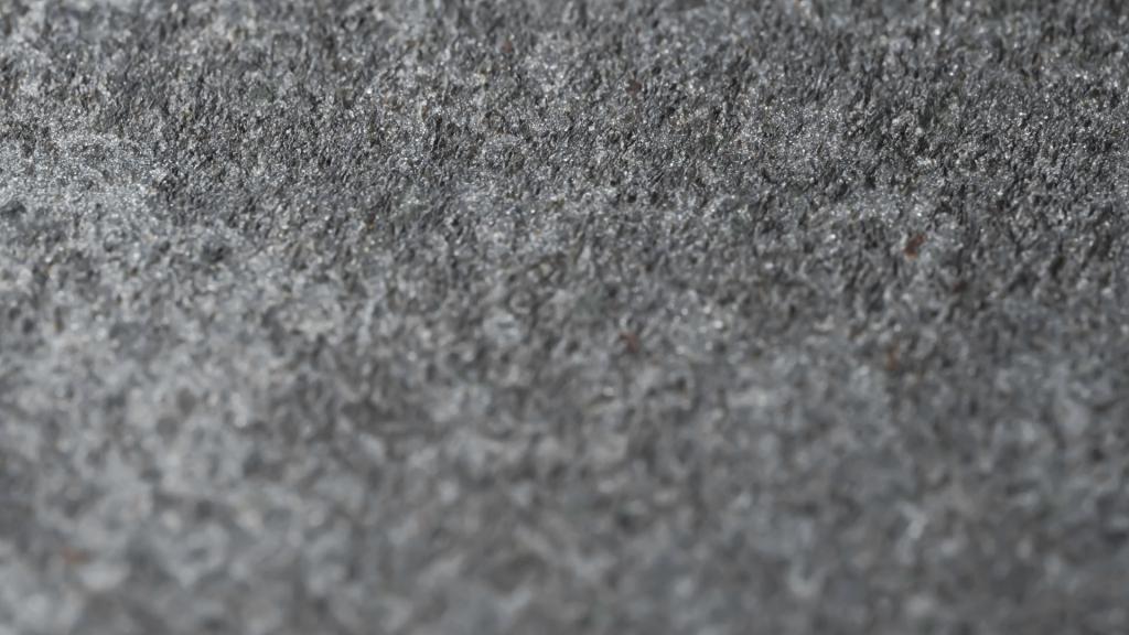 Close up textured view of Grey stone in Bentley architecture.