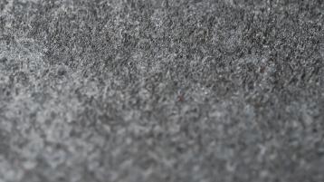 Close up view of grey textured stone.