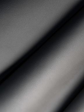 Granular view of dark textured hide for Bentley Flying Spur Mulliner