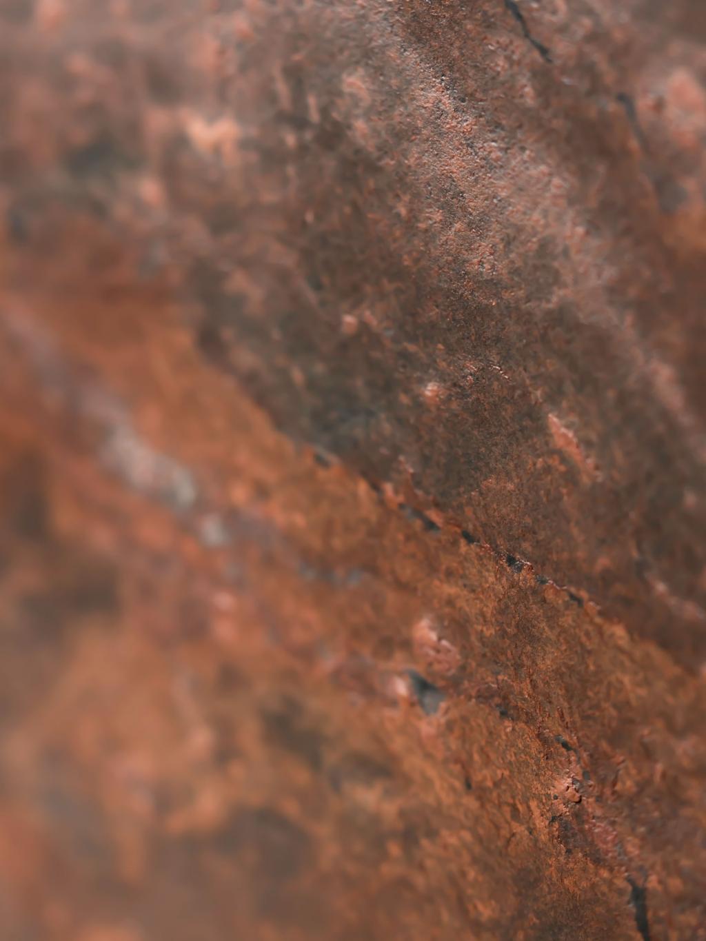 Textured view of red rock stone.