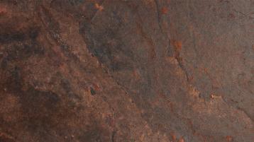 Detailed textured view of red stone.