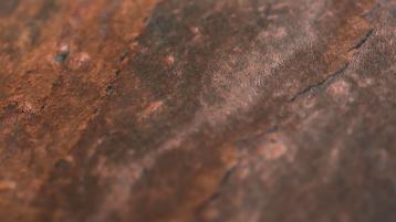 Detailed textured view of Terra Red stone veneer