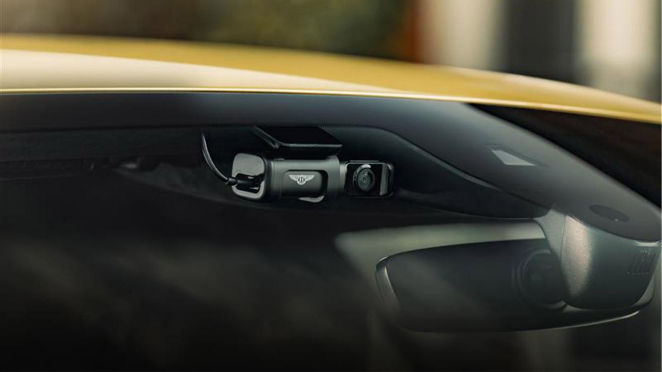 A close up of the front view camera available as part of Bentley Drive Vision