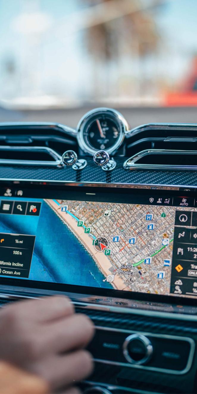 Bentley 12.3 inch full HD infotainment touch screen with hard buttons at bottom currently set up for navigation
