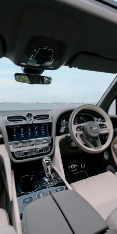 Interior view of Bentley Bentayga EWB Azure, in right hand steering wheel configuration with centre console in view.