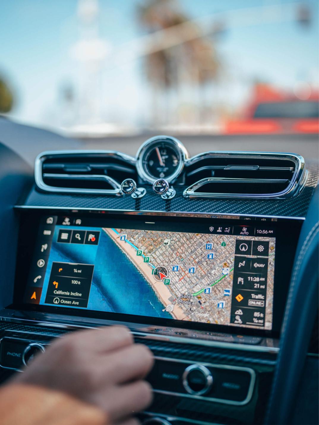 Bentley 12.3 inch full HD infotainment touch screen with hard buttons at bottom currently set up for navigation