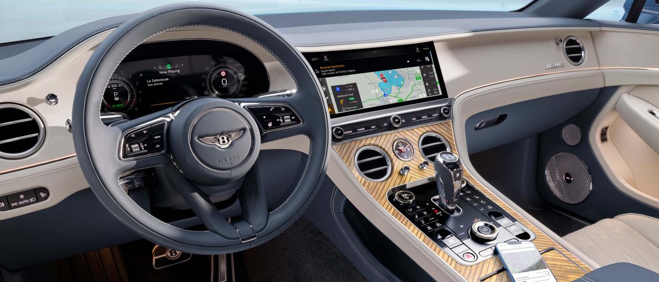 Interior of Bentley Continental GTC Azure with a mobile phone connected to the infotainment system