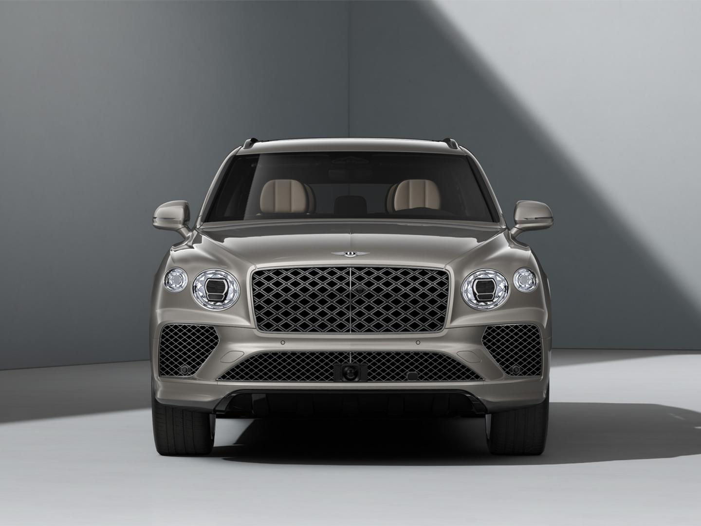 Bentley Bentayga EWB Mulliner side view in Tanzanite Purple with chrome accents driving along a highway.