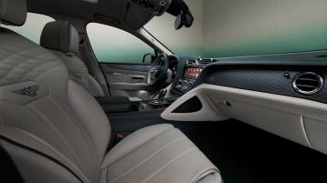 Wisdom Kaye looking into the front cabin of the Bentayga Atelier Edition with Portland main hide and Cumbrian Green secondary hide