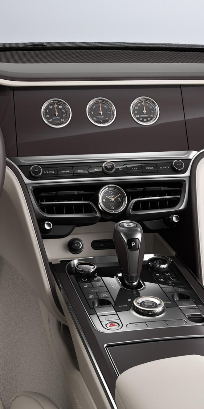 Close-up shot of the Bentley Flying Spur Azure rotating display with Piano Burnt Oak veneer.