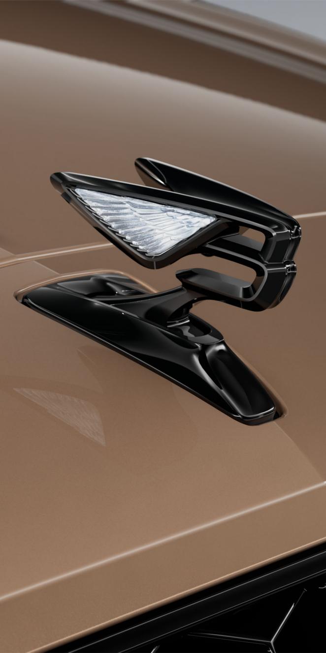 Close-up of the Flying B bonnet mascot on the Bentley Flying Spur S in Rose Gold.